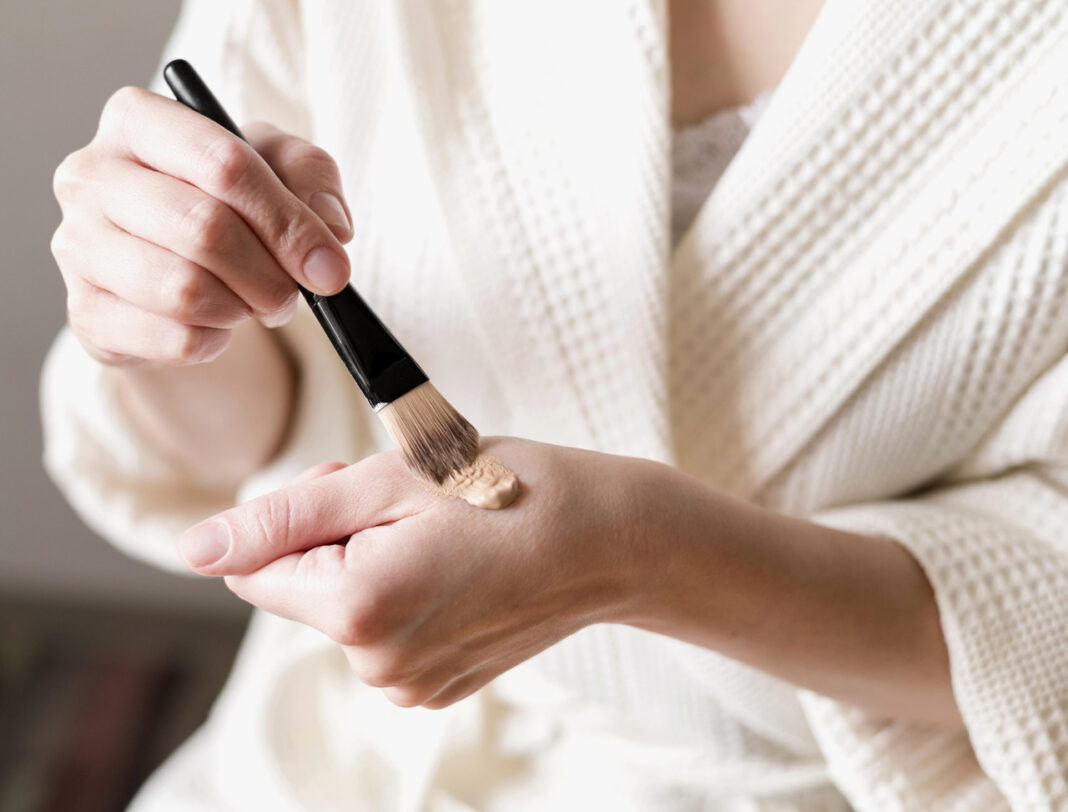close-up-foundation-applied-hand-with-brush